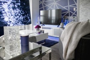 a room with a bed and a television